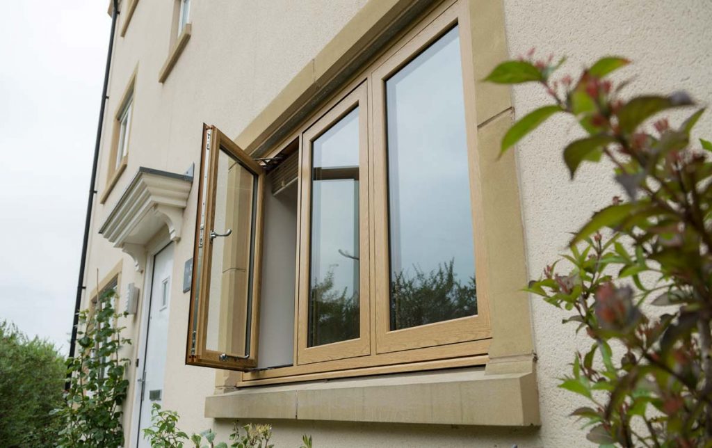 New house windows in english oak colour - flush sash window in uPVC