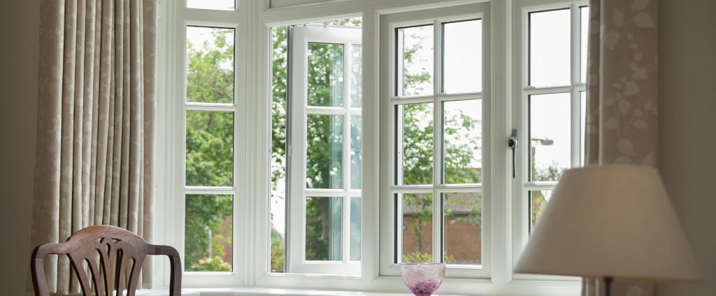 Internal living room view of white casement windows