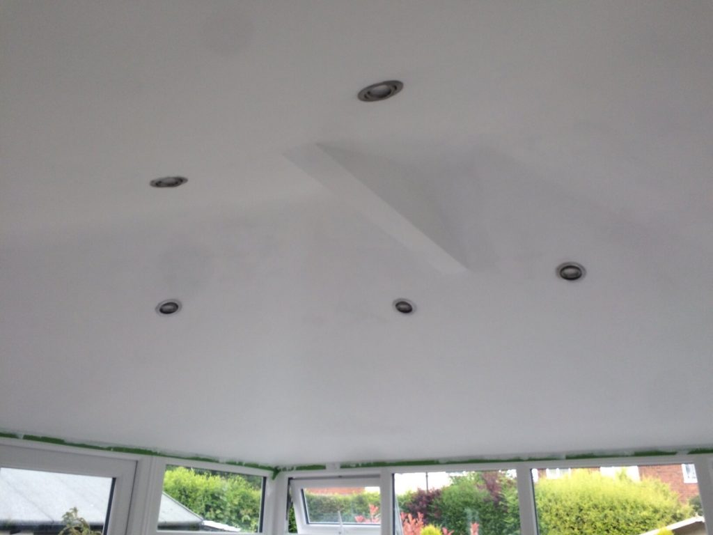 LED spotlights on tiled roof conservatory