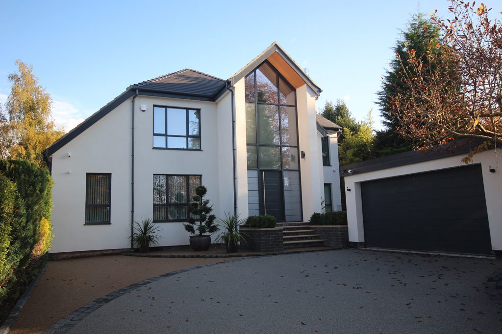 Mr & Mrs Claffey White home with black uPVC windows.