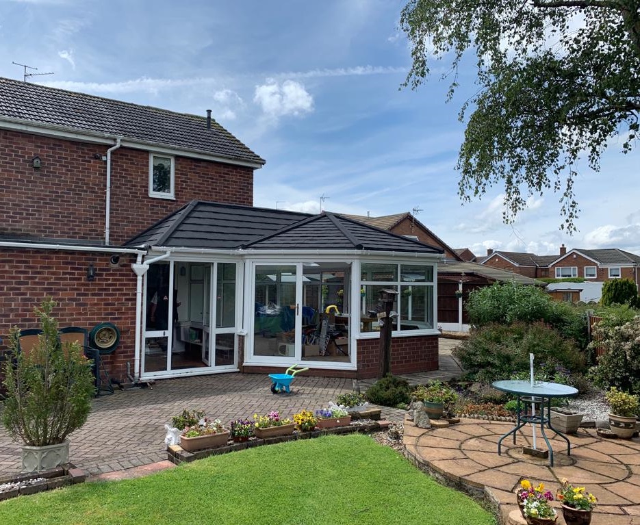 Black tiled roof replacement in Ashton-under-Lyne