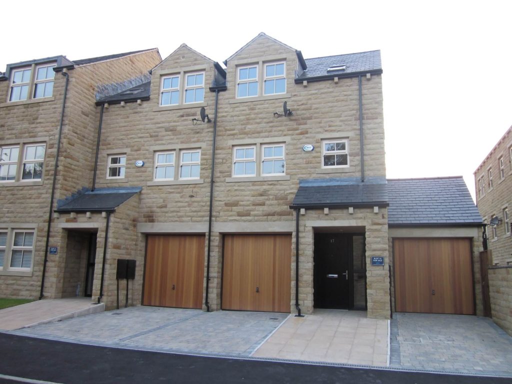 Cream uPVC casement windows with black composite doors