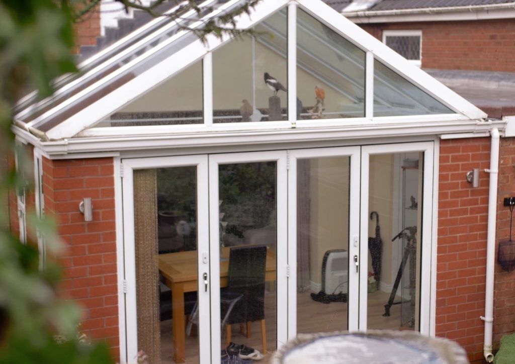 Gable roof mock orangery with bifold doors