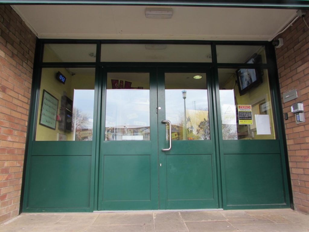 Green aluminium double doors with toughened glass