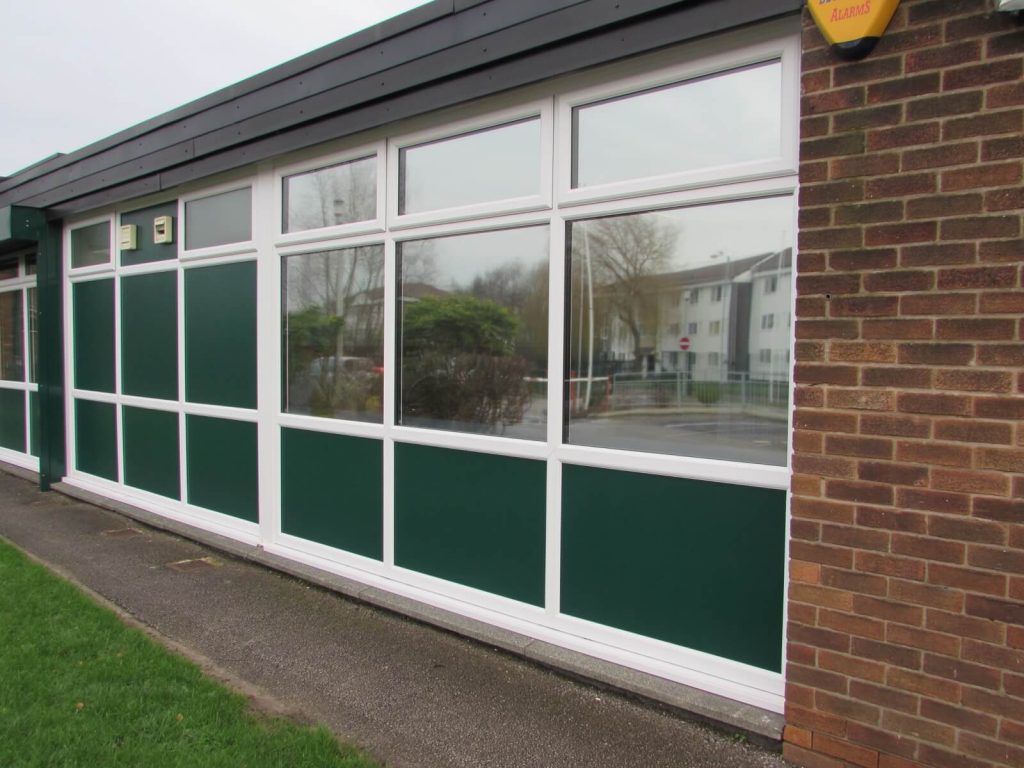 White uPVC windows with Green insulated panels