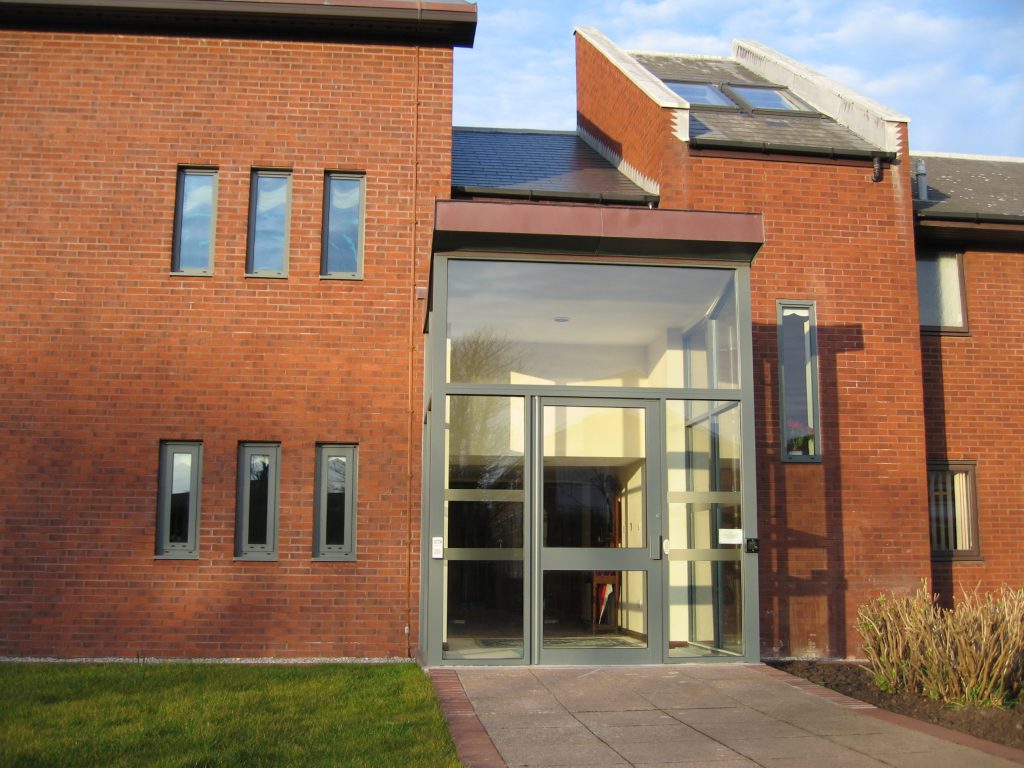 exterior shot of block of flats with aluminium entrance door