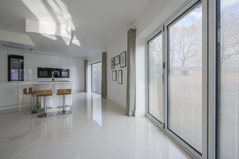 Integral blinds on bi-fold doors