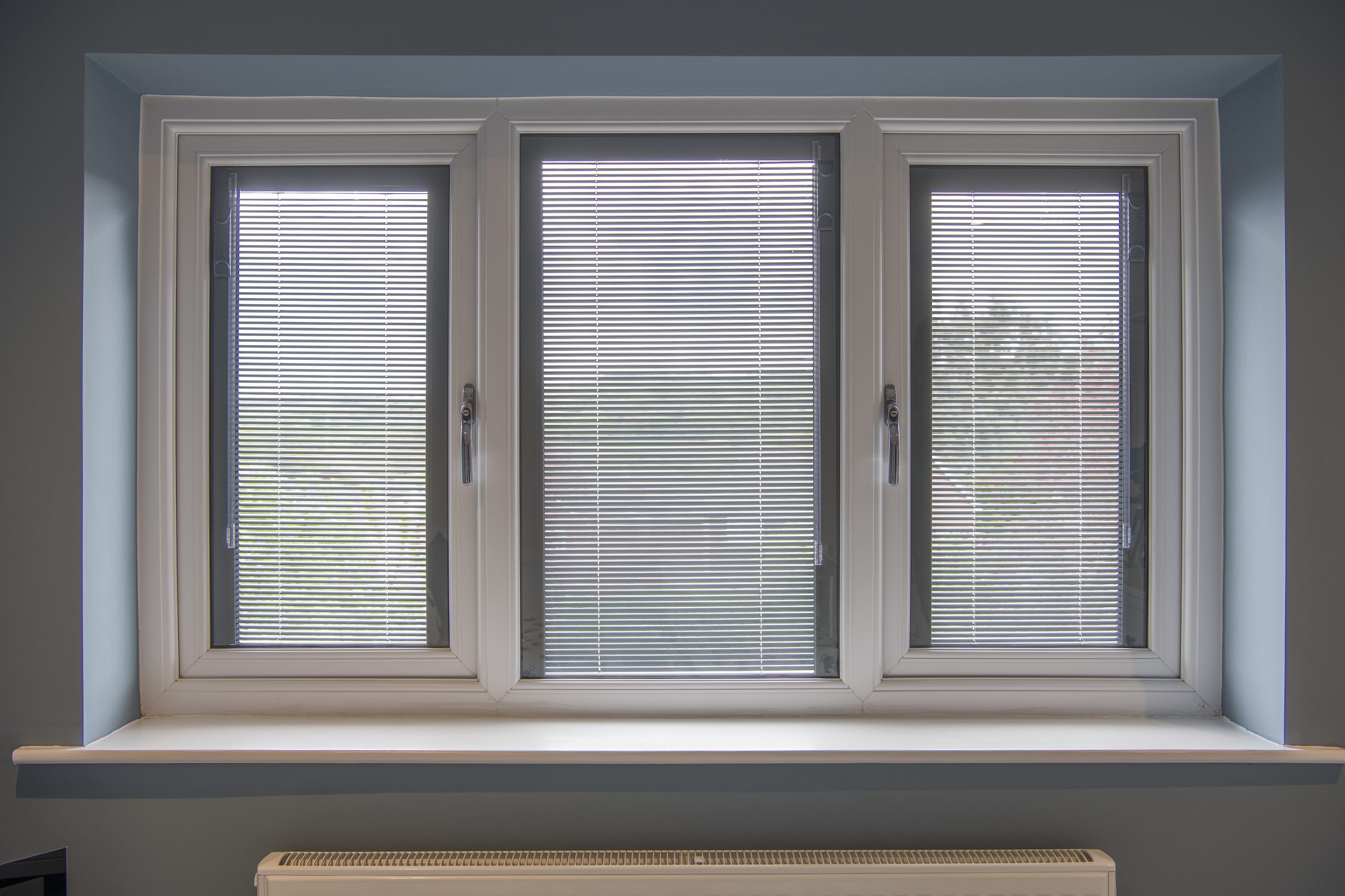 windows with built-in blinds manchester